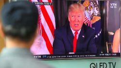 A man watches a television news programme showing US President Donald Trump at a railway station in Seoul on August 9, 2017.
President Donald Trump issued an apocalyptic warning to North Korea on Tuesday, saying it faces "fire and fury" over its missile program, after US media reported Pyongyang has successfully miniaturized a nuclear warhead. / AFP PHOTO / JUNG Yeon-Je        (Photo credit should read JUNG YEON-JE/AFP/Getty Images)