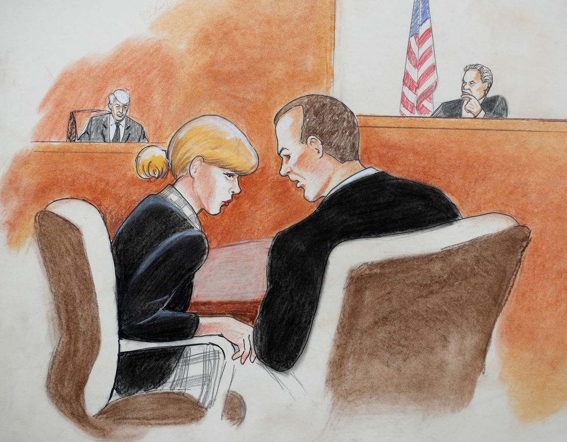 Taylor Swift, front left, conferred with her attorney in the civil trial on Tuesday.
