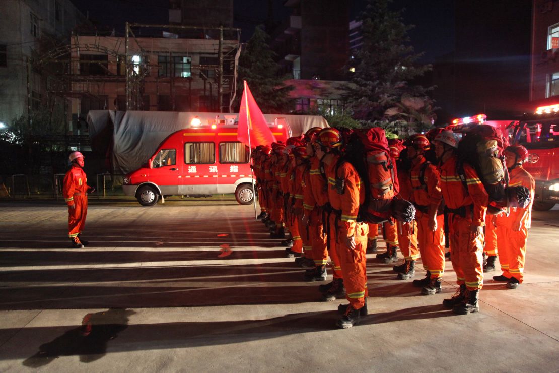 Firefighters in China's Gansu province preparing to head to Sichuan on August 8.
