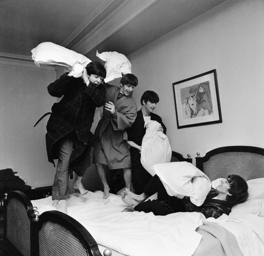 "They weren't keen at first," writes photographer Harry Benson of when he put the idea for this photo to the Beatles. "John said it would make them look childish, then he hit Paul in the back of the head with the pillow and it went from there." 