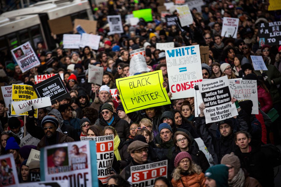 Crowds protested the killing of black men, but online, others cheered. 