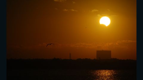 Partial solar eclipse over NASA's Vehicle Assembly Building on November 3rd, 2013