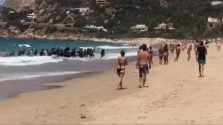 migrant boat lands on spanish beach