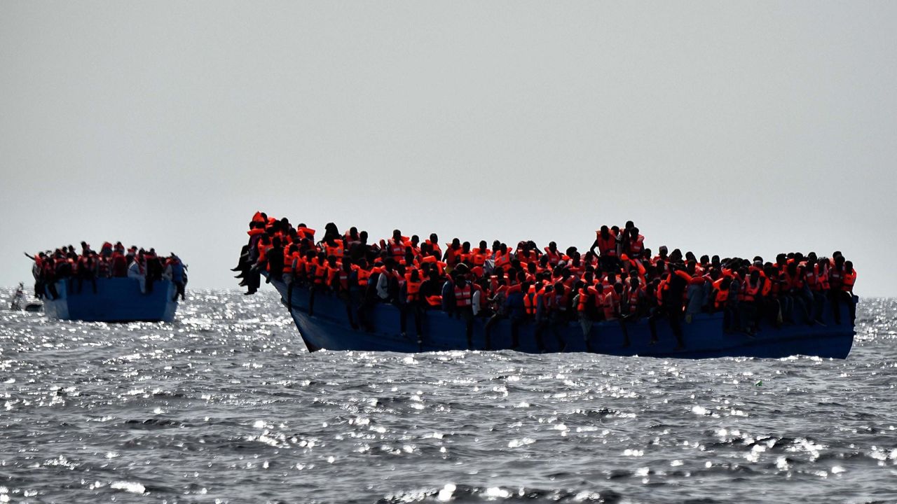 Migrants wait to be rescued as they drift in the Mediterranean Sea off the coast of Libya in October 2016. 
