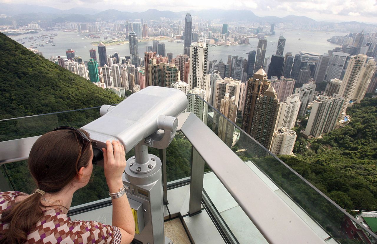 <strong>Peak Tower: </strong>A woman looks at the view from the Peak Tower, which claims to be the highest viewing platform in Hong Kong. Entry costs roughly $6.50.