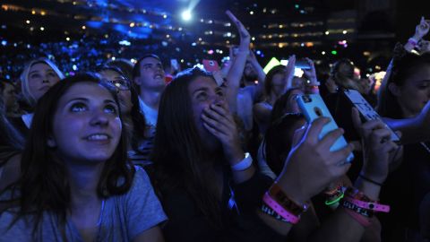 Fans react to Taylor Swift as she performs on her "The 1989 World Tour" at Raymond James Stadium on October 31, 2015 in Tampa, Florida.
