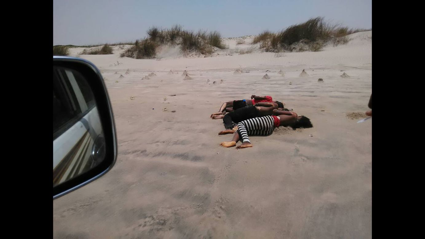 Three drowned migrants lie on a beach near Aden, Yemen, on Wednesday, August 9. A smuggler <a href="http://www.cnn.com/2017/08/09/africa/africa-migrants-feared-dead/index.html" target="_blank">deliberately drowned up to 50 Somali and Ethiopian migrants</a> in the sea off Yemen's coast, the United Nations migration agency said.