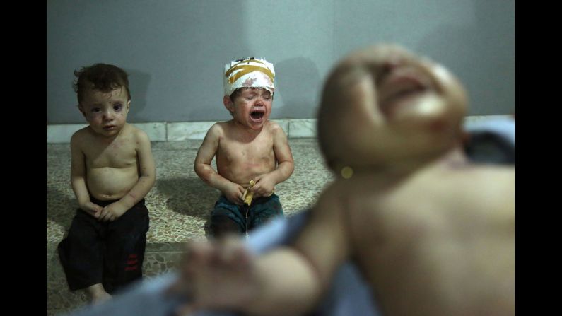 Children injured in an airstrike wait to receive treatment at a makeshift hospital in Jobar, Syria, on Saturday August 5. The country's <a href="http://www.cnn.com/specials/middleeast/syria" target="_blank">civil war</a> began in 2011.