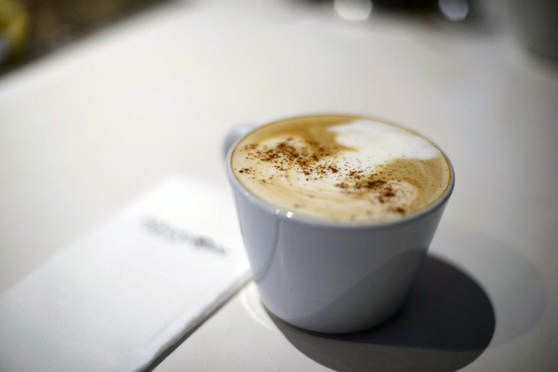 Staff at Infusion Coffee are trying to perfect mushroom cloud designs on latte foam. 