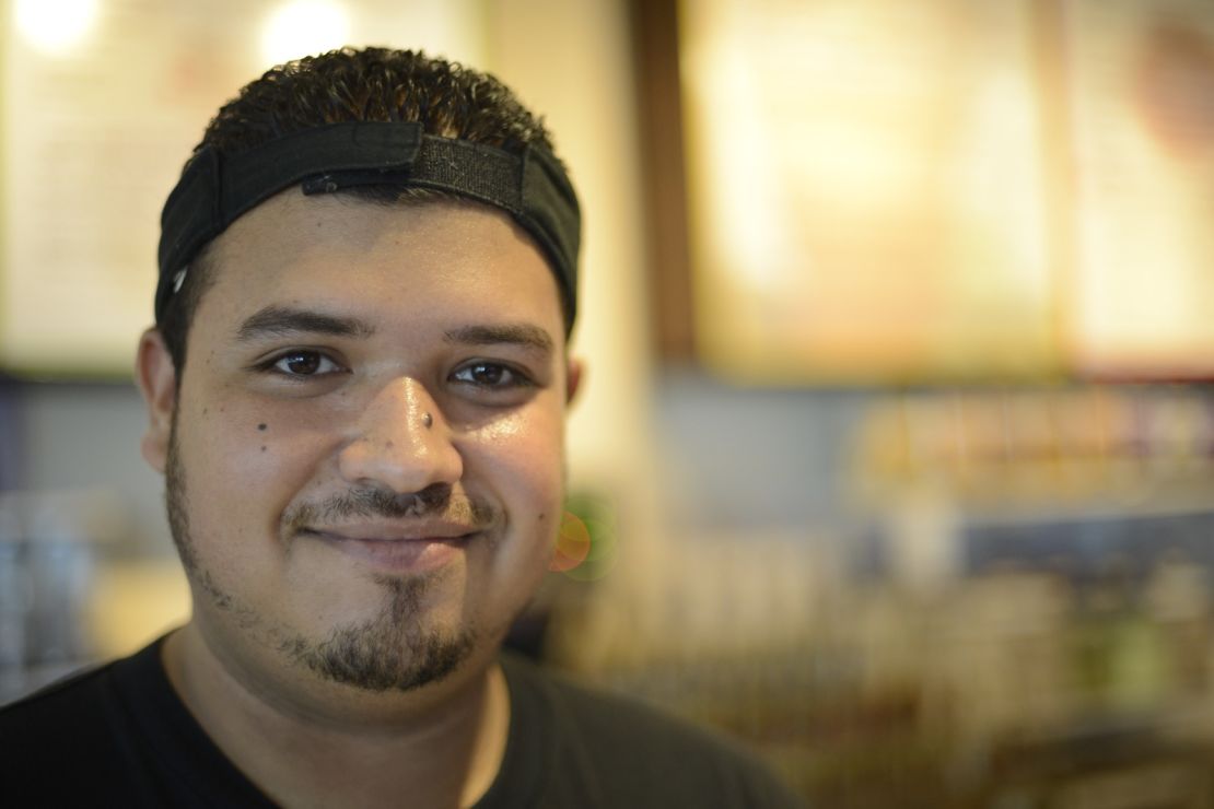Mark Alex, 26, works at Infusion Coffee, where staff are trying to perfect mushroom cloud designs on latte foam.