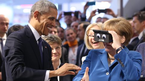 Merkel and Obama test a virtual-reality headset at a trade fair in Hanover, Germany, in April 2016.