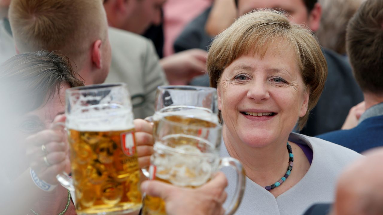 Merkel raises her glass during a toast at the Trudering Festival in Munich, Germany, in May 2017.