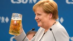 MUNICH, GERMANY - MAY 28: German Chancellor and Chairwoman of the German Christian Democrats (CDU) Angela Merkel holds a beer mug after her speech at the Trudering fest on May 28, 2017 in Munich, Germany. The CDU and CSU, along with the German Social Democrats (SPD), form the current German coalition government, though relations between Merkel and Seehofer have been complicated as the two have clashed over certain issues, especially immigration.  (Photo by Sebastian Widmann/Getty Images)