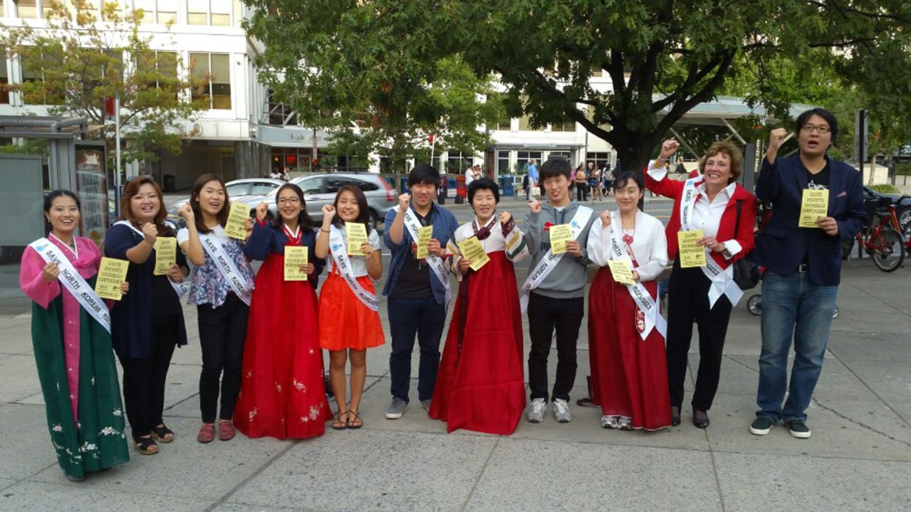 Grace Jo (far left) and her sister Jinhye Jo (second from left) gather with volunteers to raise awareness about North Korean refugees.