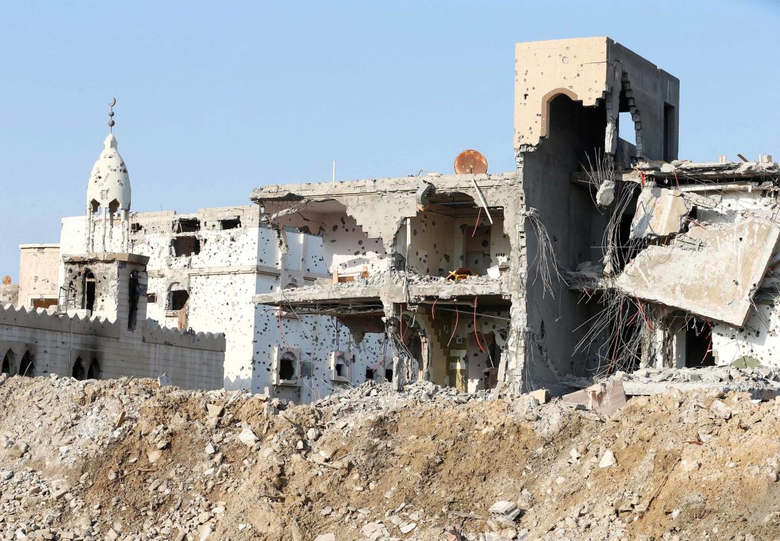 A damaged mosque and remains of buildings in Awamiya.