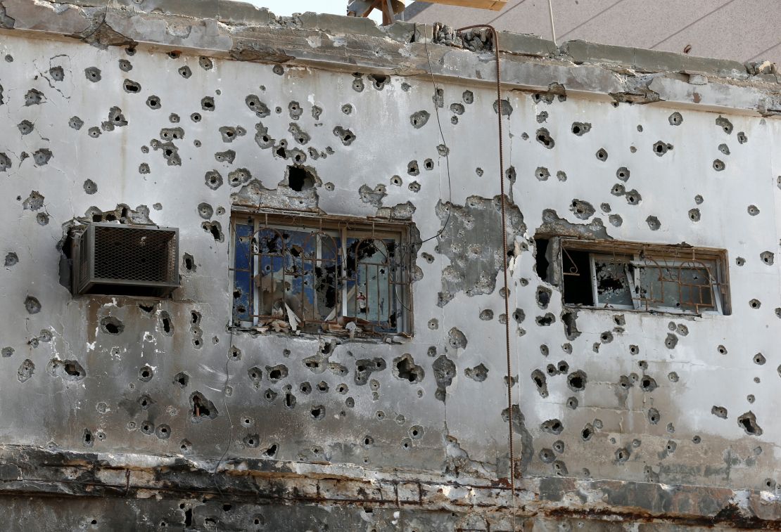 A pockmarked building in Awamiya.