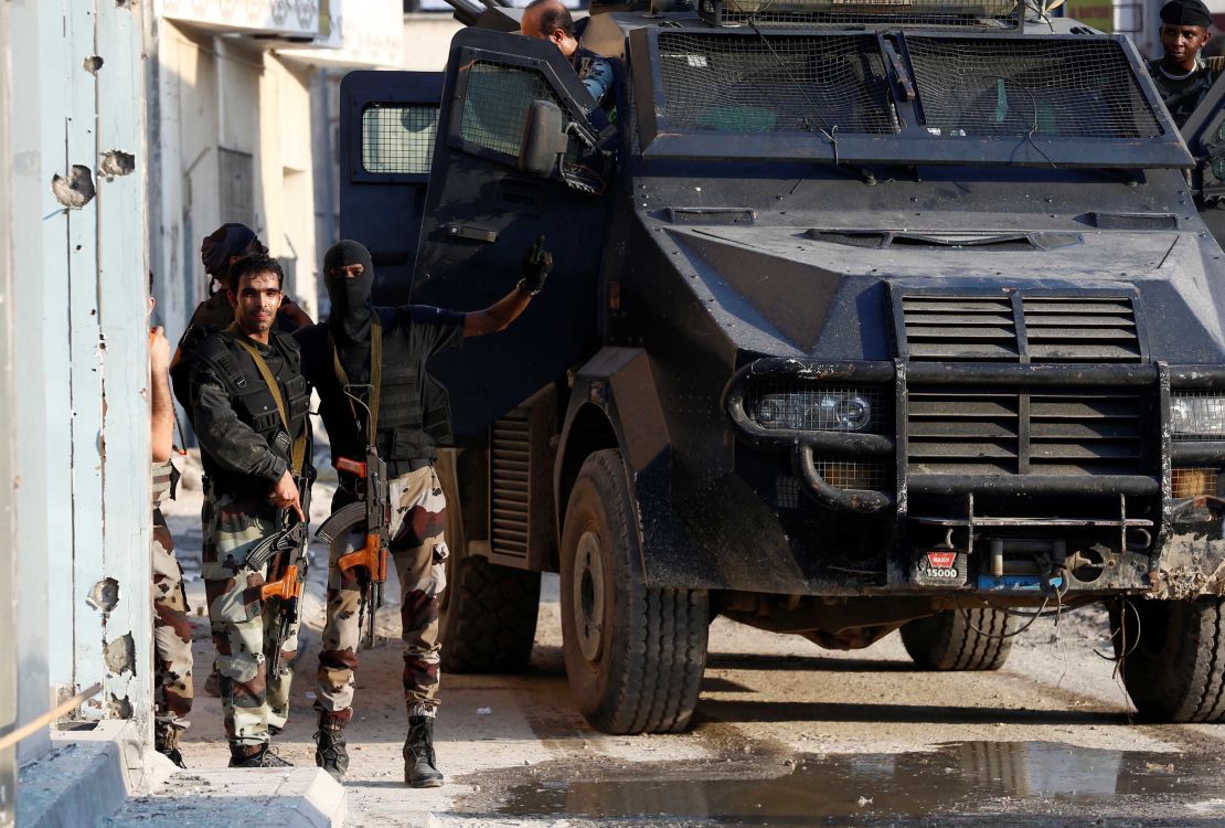Members of Saudi Special Forces stand guard in the town of Awamiya.