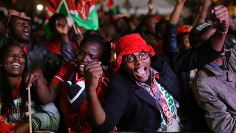 Supporters of Kenya's President Uhuru Kenyatta cheer as they hear the election results, downtown Nairobi, Kenya,  Friday, Aug. 11, 2017.  Opposition candidate Raila Odinga claimed the vote was rigged. 