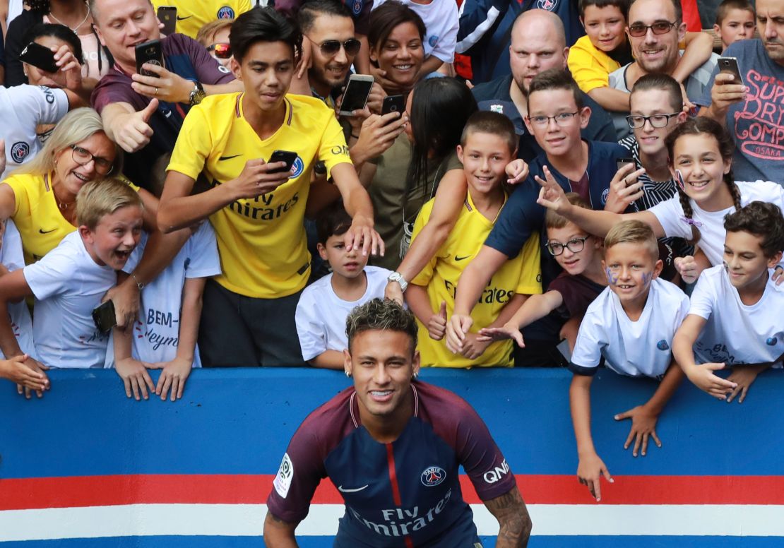 Neymar poses for a photograph at his presentation PSG on August 5.