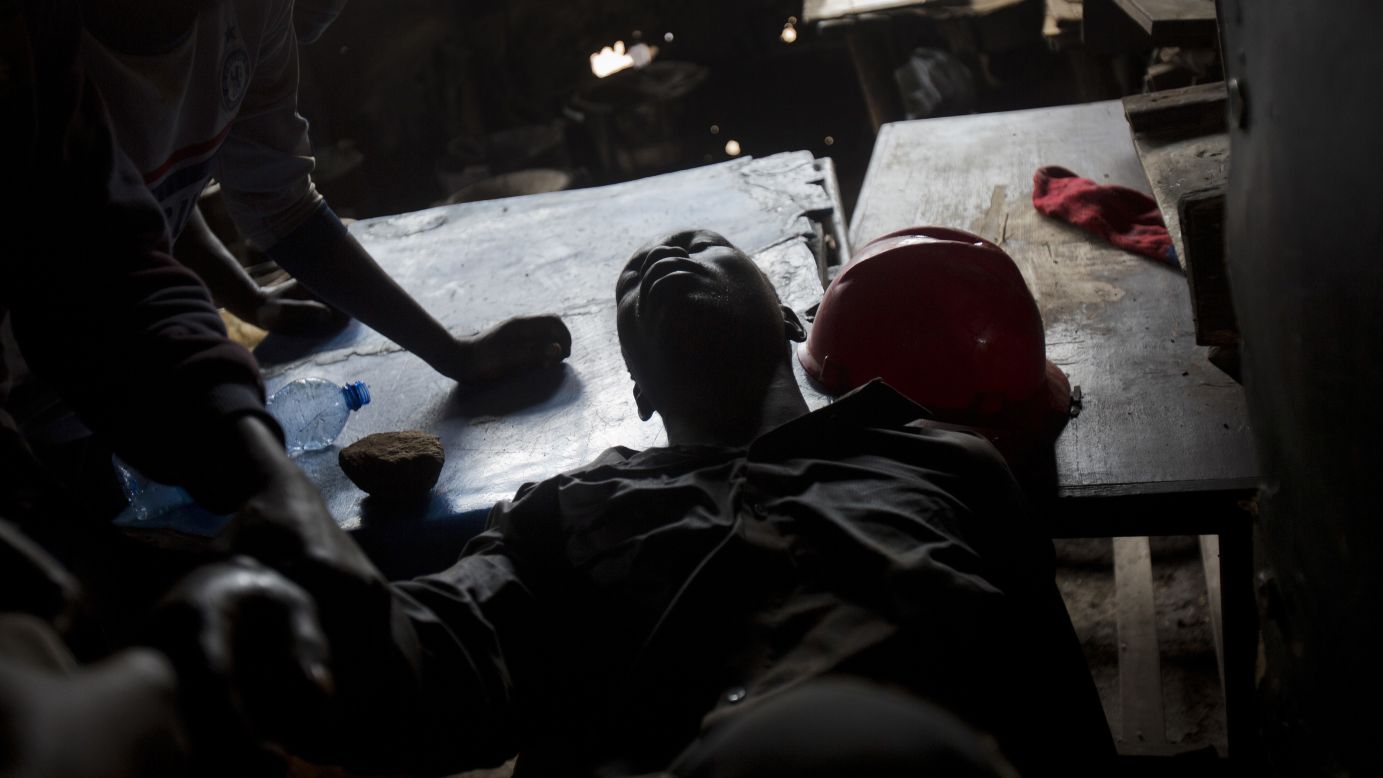 An Odinga supporter is treated after being shot during protests in the Kibera slum of Nairobi.