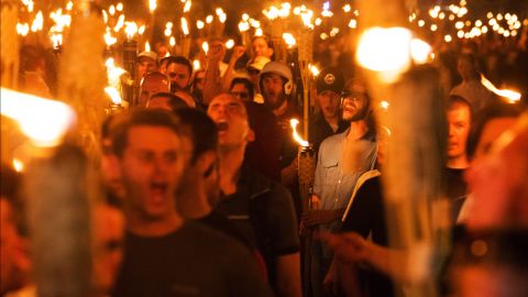White nationalists and others march Friday night through the University of Virginia campus.