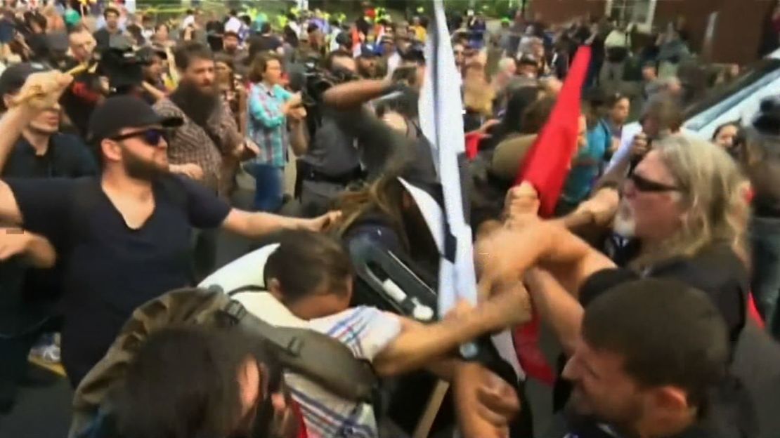 Demonstrators clash late Saturday morning in Charlottesville, Virginia.