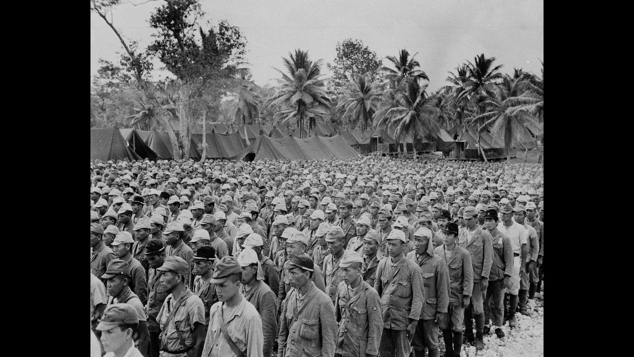Some of the 2,600 Japanese prisoners of war, who comprised the enemy garrison on the island of Rota, are lined up in a POW stockade on nearby Guam, in the Mariana Islands, September 5, 1945. 