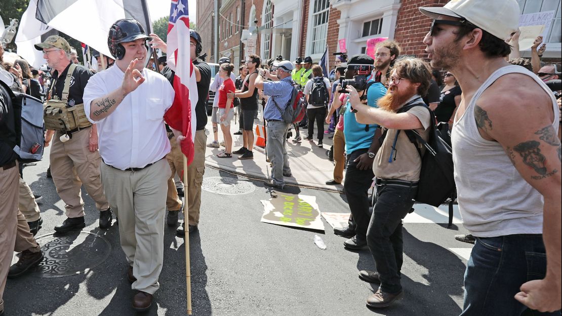 Hundreds of White nationalists, neo-Nazis and members of the "alt-right" are confronted by protesters  during the "United the Right" rally August 12, 2017, in Charlottesville, Virginia. 