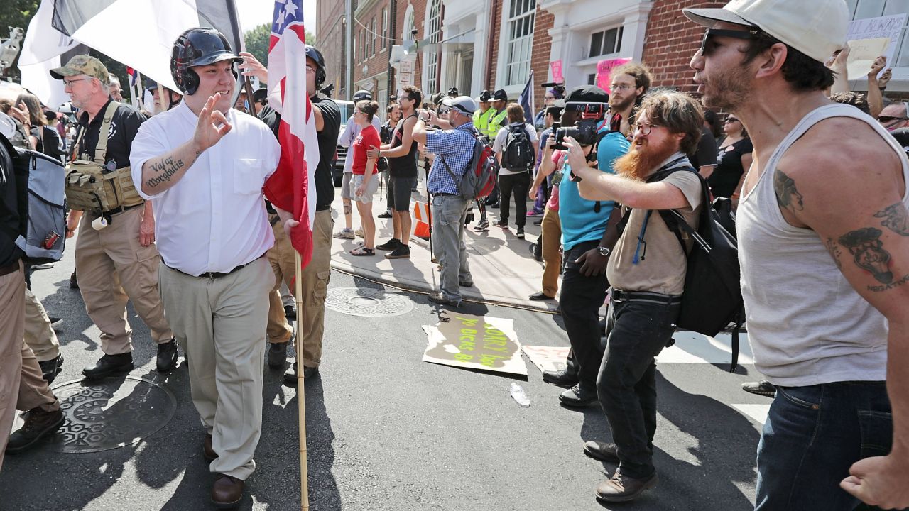 Hundreds of White nationalists, neo-Nazis and members of the "alt-right" are confronted by protesters  during the "United the Right" rally August 12, 2017, in Charlottesville, Virginia. 
