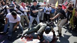 White nationalists, neo-Nazis and members of the "alt-right" clash with counter-protesters as they enter Lee Park during the "Unite the Right" rally August 12, 2017 in Charlottesville, Virginia. 