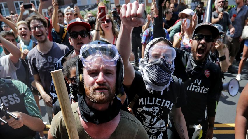 Anti-fascist counter-protesters wait outside Lee Park to hurl insluts as white nationalists, neo-Nazis and members of the "alt-right" are forced out after the "Unite the Right" rally was declared an unlawful gathering August 12, 2017 in Charlottesville, Virginia. After clashes with anti-fascist protesters and police the rally was declared an unlawful gathering and people were forced out of Lee Park, where a statue of Confederate General Robert E. Lee is slated to be removed. 