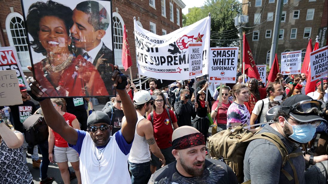 Counterprotesters line the route taken by white nationalists and neo-Nazis during the "Unite the Right" rally. After clashes with anti-fascist protesters and police, the rally was declared an unlawful gathering and people were forced out of Emancipation Park, formerly called Lee Park and home to a controversial statue of Confederate Gen. Robert E. Lee.  