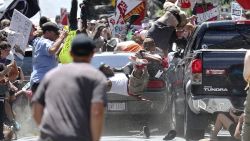 People fly into the air as a vehicle drives into a group of protesters demonstrating against a white nationalist rally in Charlottesville, Virginiaon Saturday, August 12, 2017. The nationalists were holding the rally to protest plans by the city of Charlottesville to remove a statue of Confederate Gen. Robert E. Lee. There were several hundred protesters marching in a long line when the car drove into a group of them.