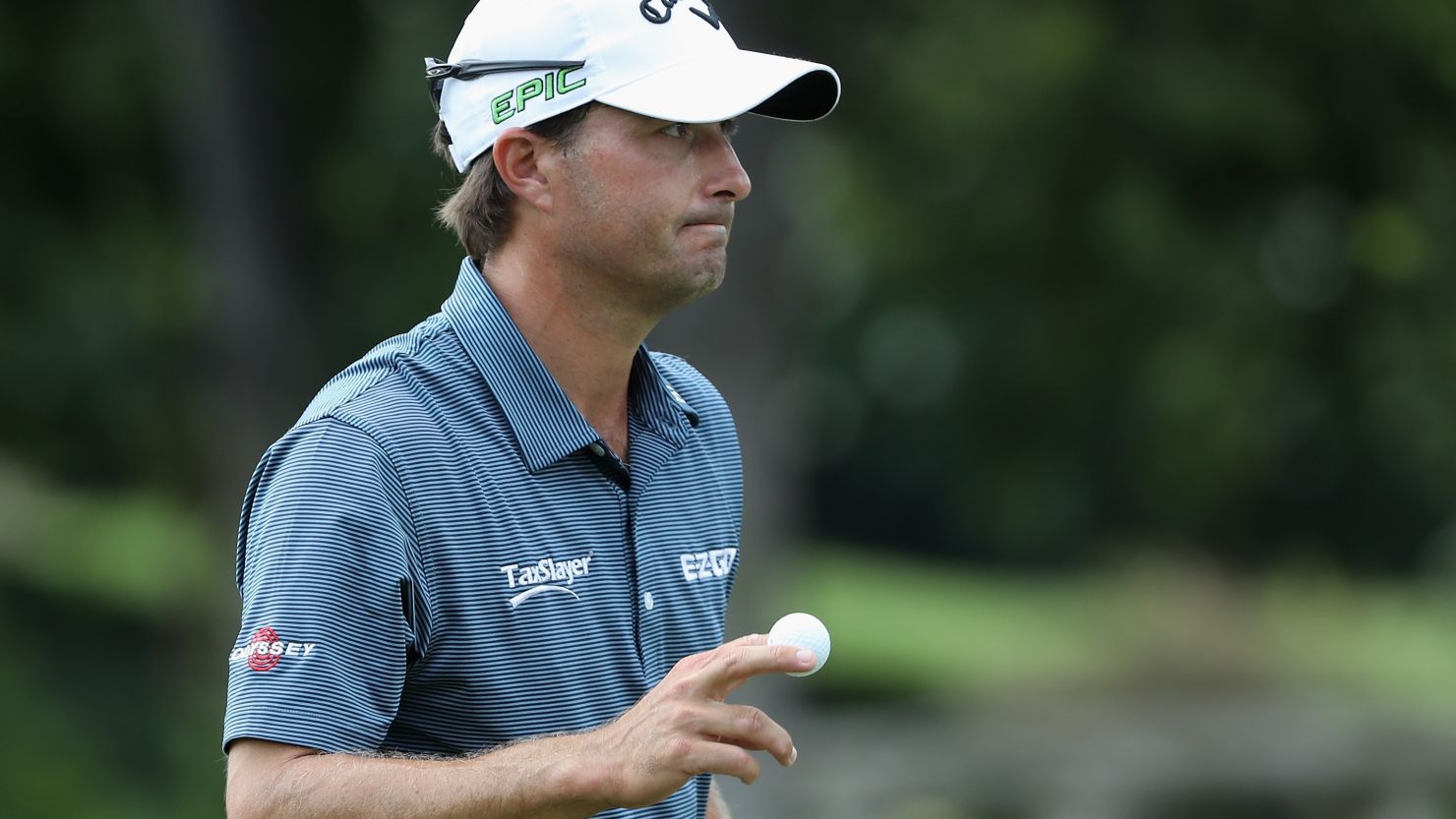 Kevin Kisner combined fine play from tee to green with solid putting to maintain his lead at the US PGA Championship.