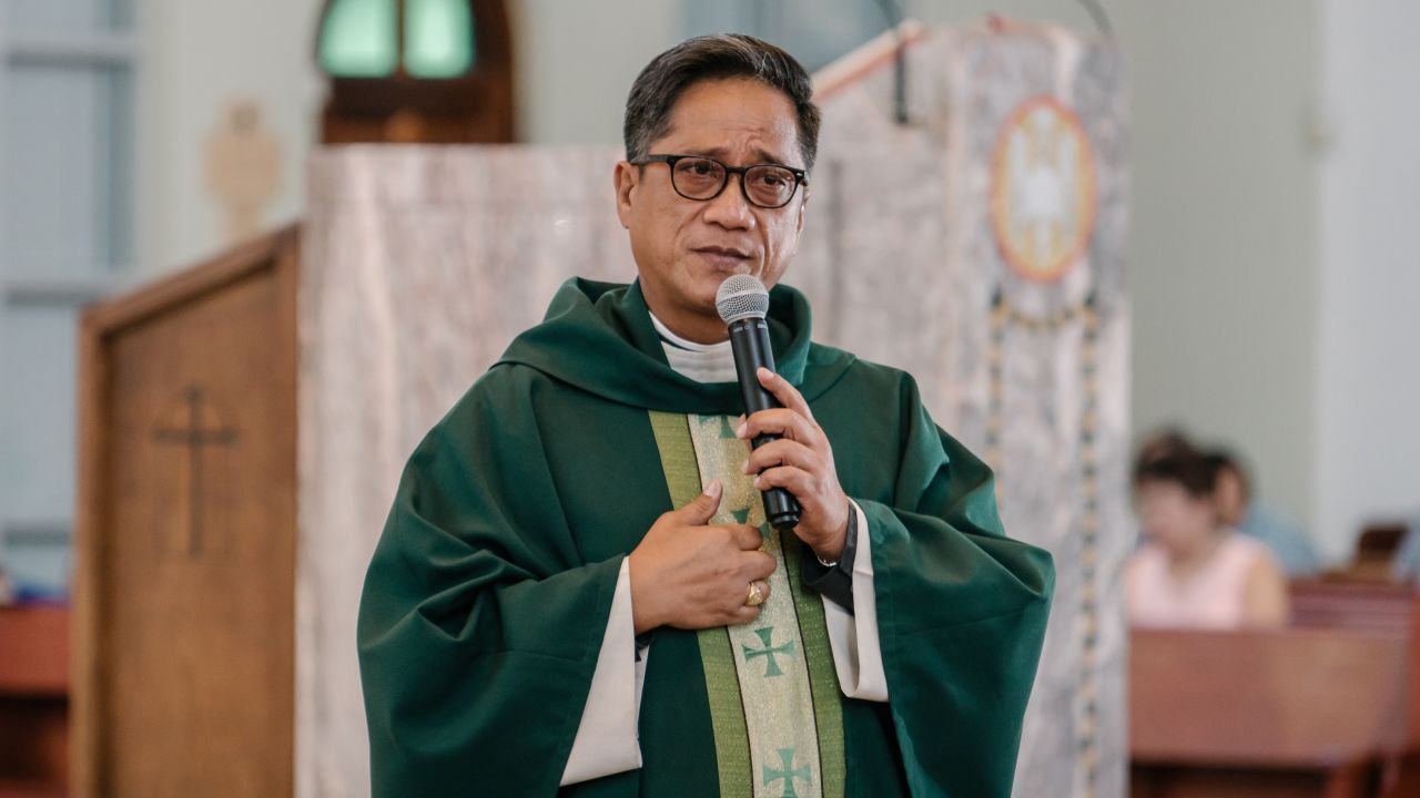 Father Paul Gofigan preaches at Sunday mass on August 13.