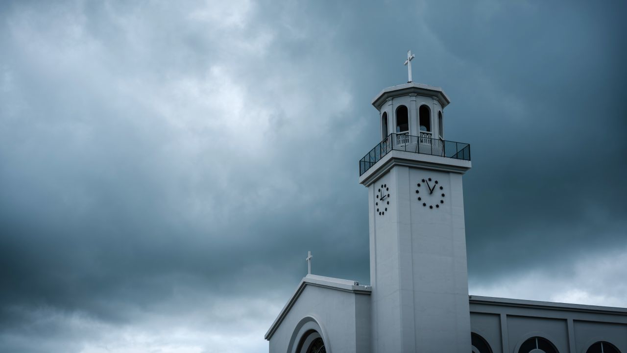 Heavy clouds hover over Dulce Nombre de Maria Cathedral-Basilica in Hagatna, Guam on August 13.
