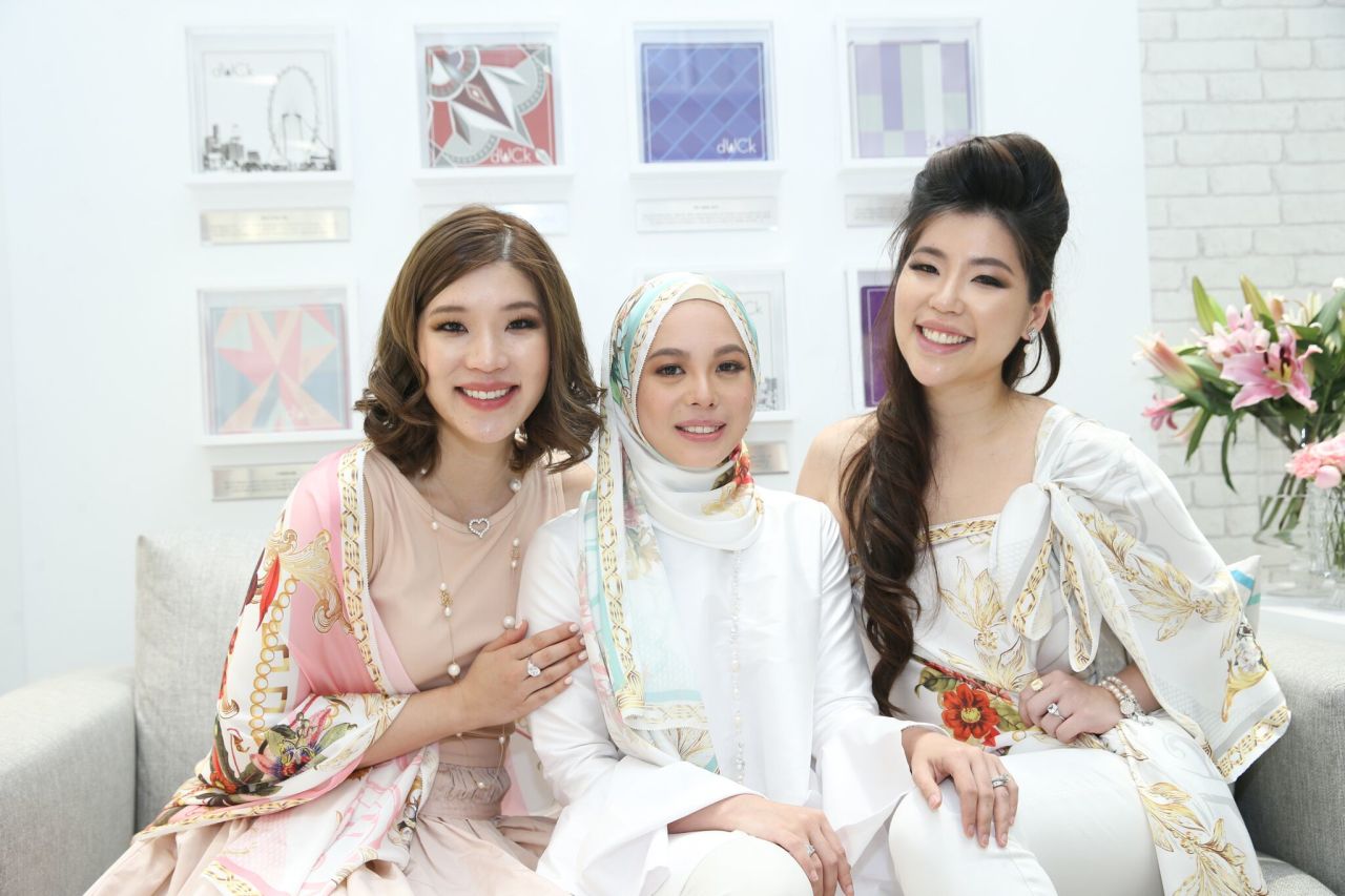 Yusof (center) wears one of her creations.