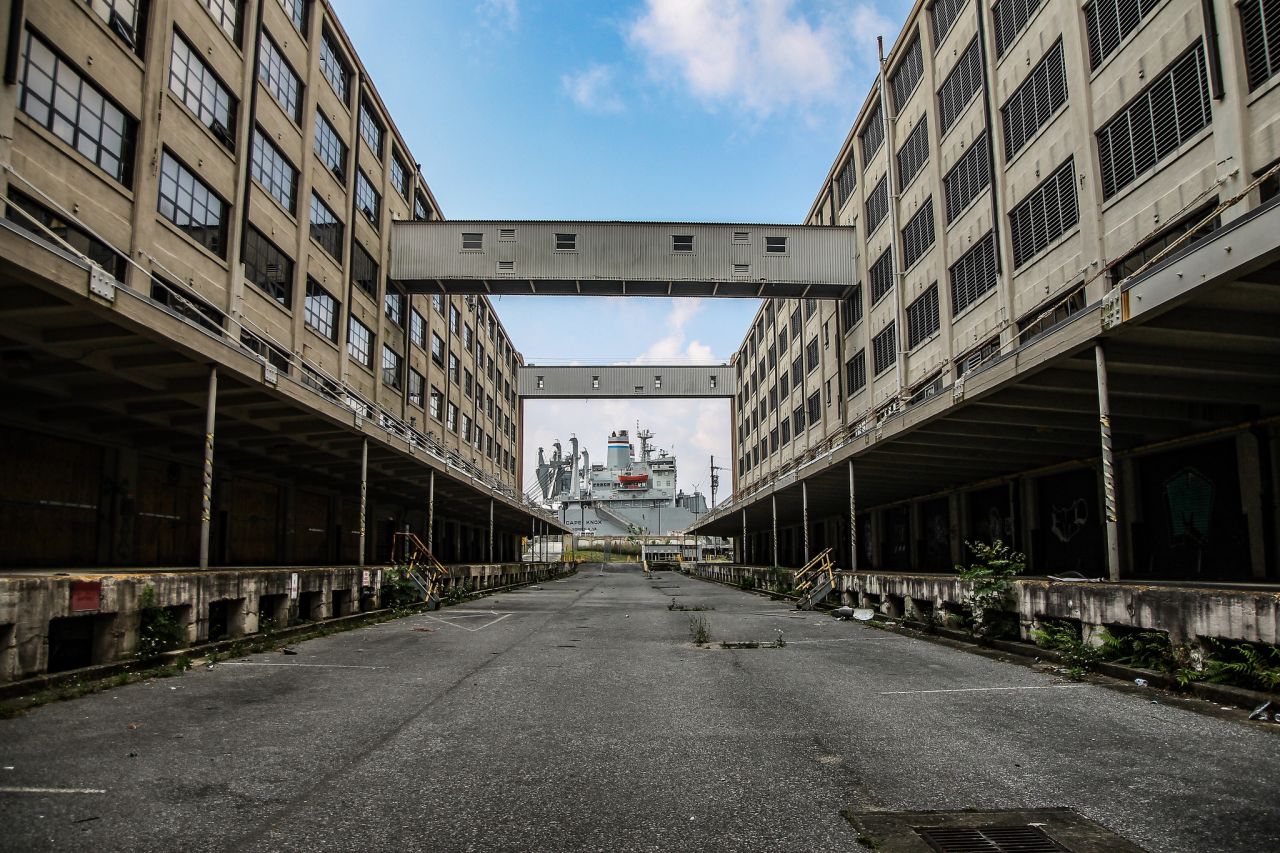 The vessel Cape Knox remains docked behind the abandoned complex in a ready-reserve status. 