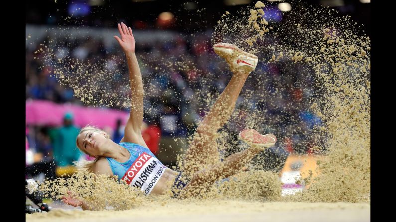 Russian long jumper Darya Klishina lands in the sand pit during the World Championships on Wednesday, August 9. She finished with the silver.