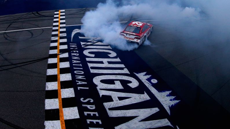 NASCAR driver Kyle Larson celebrates his Cup Series win with a burnout Sunday, August 13, at Michigan International Speedway. He has won three straight races at the track.