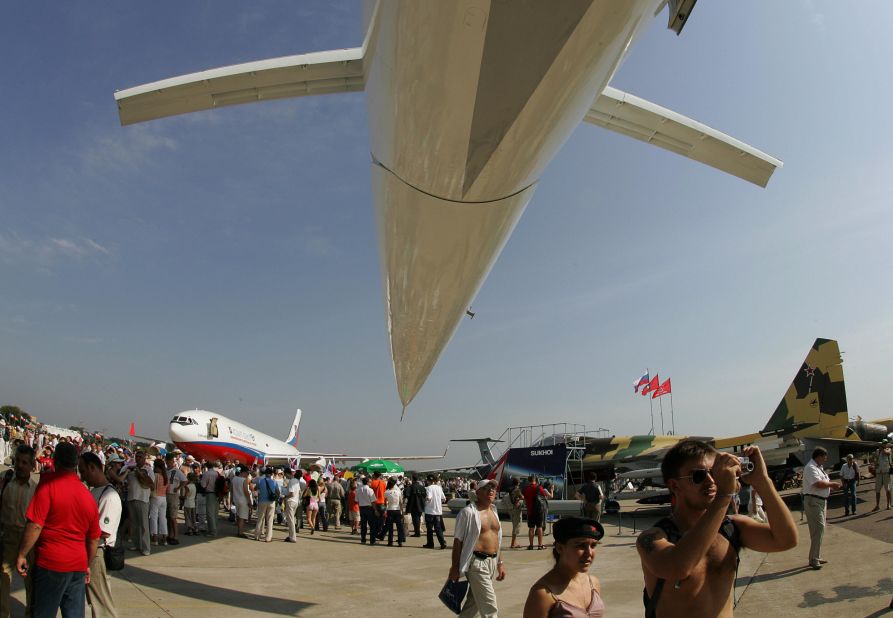 A visitor takes a picture in front of a Tu-144 at the MAKS-2007 at the Zhukovsky Airfield outside Moscow.