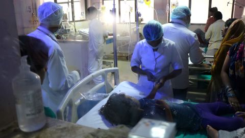 Nurses examining the patients at wad L of the ICU at BRD Medical College in Gorakhpur, Uttar Pradesh.
