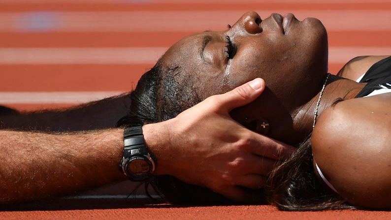 Deborah John, a hurdler from Trinidad and Tobago, receives medical attention Friday, August 11, after she crashed headfirst into a hurdle during a race at the World Championships. She was stretchered away and taken to the hospital, but she was not seriously injured.