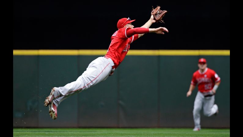 Andrelton Simmons, shortstop for the Los Angeles Angels, snags a line drive during a game in Seattle on Sunday, August 13.