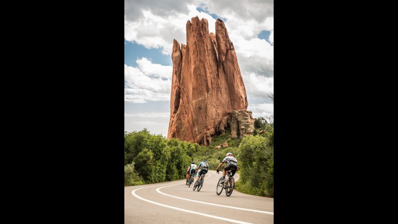 The winding route, the racers say, is hard but fun. At the top of the mountain, it winds past red moon rock formations jutting into the sky like hands of an ancient giant. 