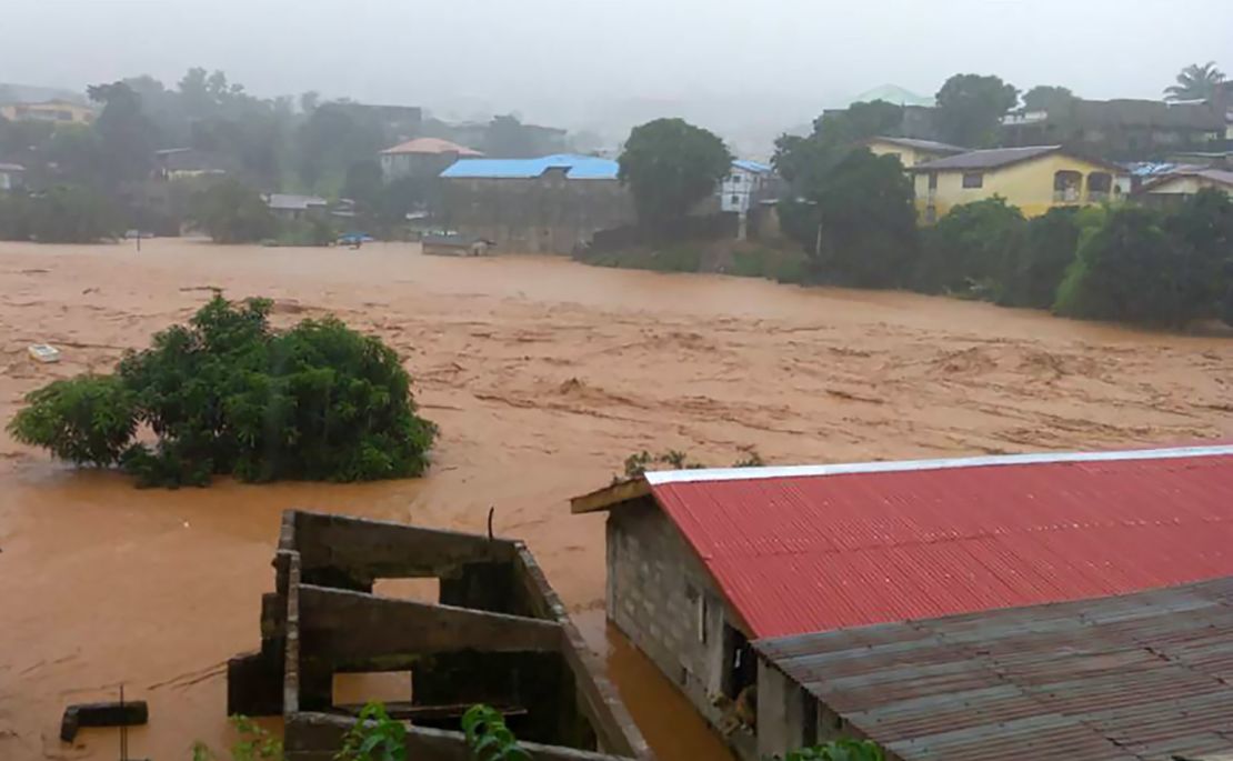 Floodwaters overwhelm the streets of Regent in Freetown on Monday. 