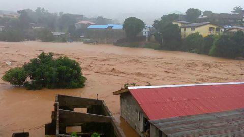 Floodwaters overwhelm the streets of Regent in Freetown on Monday. 