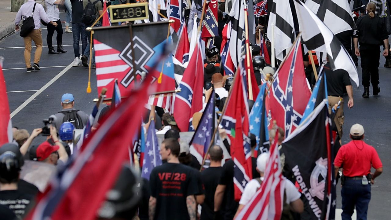 Hundreds of white nationalists, neo-Nazis and members of the "alt-right" march down East Market Street toward Emancipation Park during the "Unite the Right" rally August 12, 2017 in Charlottesville, Virginia.