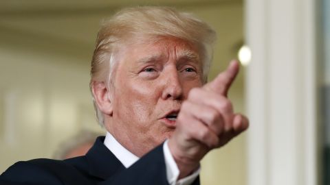 President Donald Trump points as he answers a question after an event to sign a memorandum calling for a trade investigation of China, Monday, Aug. 14, 2017, in the Diplomatic Reception Room at the White House in Washington.
