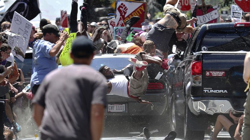 People fly into the air as a vehicle drives into a group of protesters demonstrating against a white nationalist rally in Charlottesville, Va., Saturday, Aug. 12, 2017. The nationalists were holding the rally to protest plans by the city of Charlottesville to remove a statue of Confederate Gen. Robert E. Lee. (Ryan M. Kelly/The Daily Progress via AP)